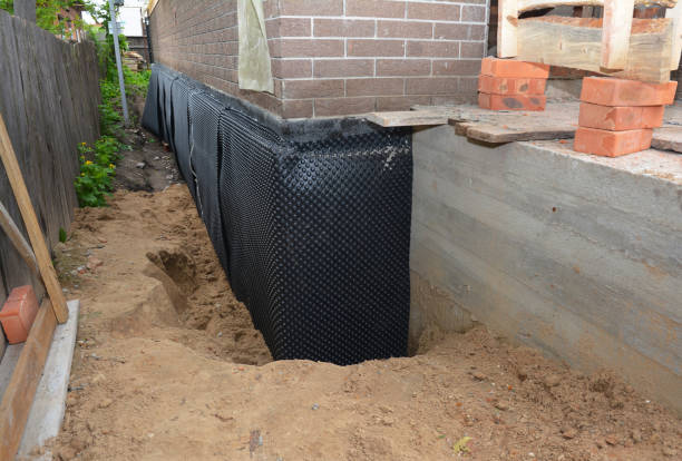 Happy homeowners after waterproofing job in Amityville